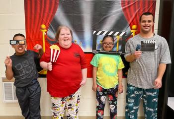 Enjoying the movie night and sleepover tradition at John Paul II Center for Special Learning, Shillington are, from left, Xavier, Logan, Alex and Angel.