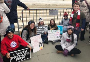 Members of the Schuylkill County Youth Group show their signs. (Photo courtesy of Dana Seisler)