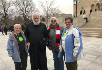 Also on the St. Ambrose bus were, from left, Theresa Heller, Father Ed Connolly, Pat Glogg and Tina Rutecky. (Photo courtesy of Dana Seisler)