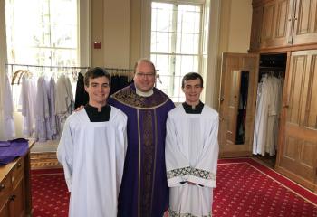 Father Gene Ritz with altar servers for the Mass at the basilica. (Photo courtesy of Father Gene Ritz, chaplain of Notre Dame High School)