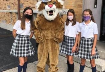 Students from St. Ann School, Emmaus are greeted by their mascot on the first day
