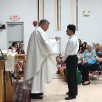 D’Angelo Lopez received First Communion from Fr. Winne on May 12, 2017. 