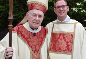 Bishop Edward Cullen congratulates Deacon John Hutta after the Mass. (Photo by John Simitz)