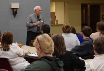 Parents and teens listen to Randy Rice’s presentation. (Photo by John Simitz)