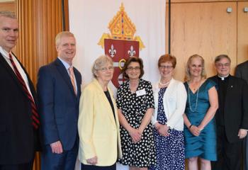 Enjoying the event are, from left: Philip Fromuth; John Bakey, diocesan chancellor for Catholic education; Susan Teskey, teacher at LaSalle Academy, Shillington, honored for 25 years of service; Mary Deemer, office manager of John Paul II Center for Special Learning, Shillington, honored for 25 years of service; Mary Hiestand, teacher at St. John Vianney Regional School, Allentown, honored for 25 years of service; Patricia Tarquinio, principal of Immaculate Conception Academy, Douglassville, honored for 25 