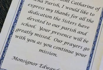 Msgr. Edward Domin’s words of thanks to the sisters on behalf of the parish in the Mass program. . (Photo courtesy Sister Teresa Ballisty)