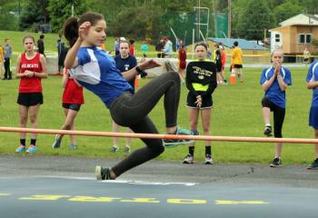 Aliah Corrado, OLPH, jumps over the bar at the high jump event.