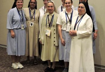 Speakers at “Mary, Our Model – Being A Christian Woman in Today’s Society” July 18 at Fiat Days are, from left, IHM Sister Mary Jo Ely; Daughters of Divine Zeal (FDZ) Sister Rose Mary Infanta; Missionary Sisters of the Most Sacred Heart of Jesus (MSC) Sister Marie Raymond Gazo; FDZ Sister Marietta Castellano; IHM postulant Beth Bartholomew; IHM postulant Christine Ann Zabel; IHM Sister Rose Bernadette Mulligan; and Poor Sisters of St. Joseph (PSSJ) Sister Eloina Alvarez. (Photo by Tami Quigley)