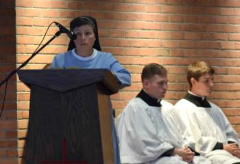 Sisters, Servants of the Immaculate Heart of Mary (IHM) Sister Mary Jo Ely serves as a lector at the opening liturgy. (Photo by John Simitz)