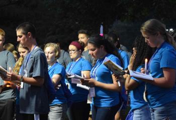 Campers participate in the outdoor Stations of The Cross. (Photo by John Simitz)