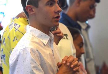 Quo Vadis participants pray during the opening afternoon Mass. (Photo by John Simitz)