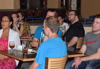 Young adults listen to Guman’s presentation, which wrapped up the summer session of Theology on Tap, sponsored by the diocesan Office of Youth, Young Adult and Family Ministry.