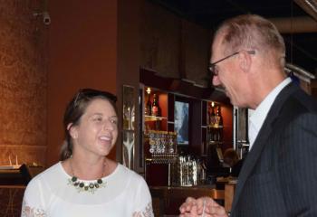 Allison Yudt speaks with Guman during the event.