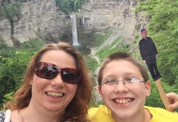Teresa and Zachary Mills bring Msgr. O’Connor along to tour Taughannock Falls, New York.