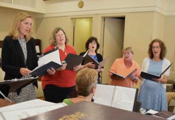 The Angelorum Choir sings a hymn during the celebration.