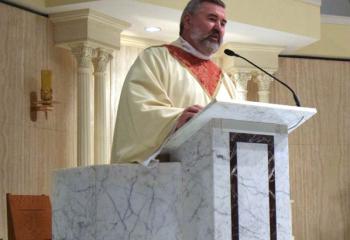 Father Thomas Bortz greets those gathered for the liturgy. 