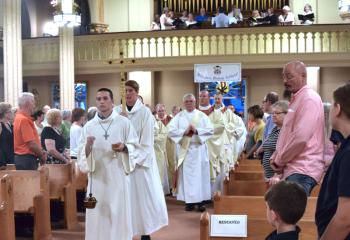 Clergy process into the evening liturgy.