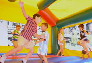 Children enjoy the Moonbounce. (Photo by John Simitz)