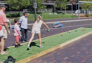 Festival-goers play a game of bocci. (Photo by John Simitz)