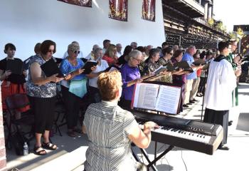 Beverly McDevitt directs the combined Diocesan and Cathedral choirs. (Photo by John Simitz)