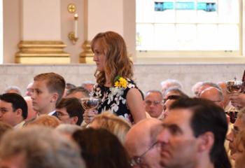 Offering the sacramental gifts are, from left, Andrew and Rosetta Shupe, Bishop Schlert’s godchildren, and his niece Caitlin Schlert. (Photo by John Simitz)