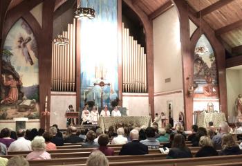 The faithful participating at Mass.