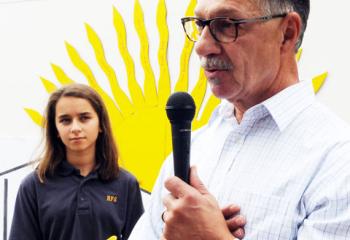 Morgan Halldorson listens as Bruce Mariano, member of the capital campaign committee, shares how the death of his daughter inspired him to volunteer in making the parish center a reality.