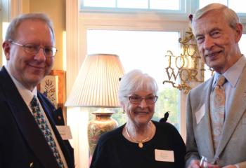 Bob Wert, left, talks with Mary Lou and Vincent Parisi.