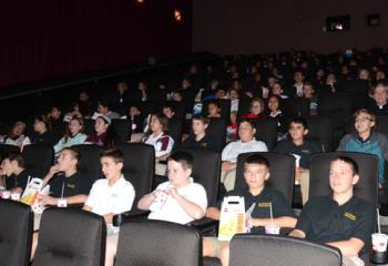 Movie snacks in hand, students of Good Shepherd Catholic School, Northampton are ready for the movie to begin.
