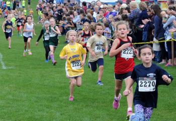 Kindergarten girls run during the meet.