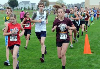 Seventh- and eighth-grade boys and girls run at the meet.