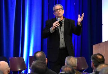 Marty Rotella, song writer and musician for Spirit Power, delivers one of the keynote presentations during the conference.