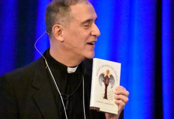 Father Ezaki suggests the book “Saints Behaving Badly” to men participating in the conference.