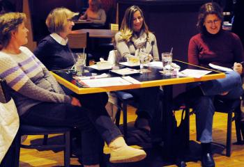 Listening to Father Stephen DeLacy’s presentation are, from left, Lee Duffy of Whitehall, and Fran Roposh, Denise Kilanowski and MarySue Kotula, all of Orefield.