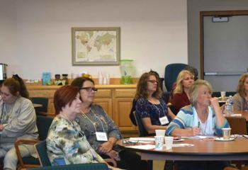 Participants listen during the workshop aimed at bettering time management skills for students.