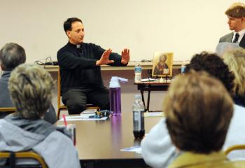 Father Gualano, left, and Rick Dooley, assistant director of the Office of Adult Formation, lead the discussion.