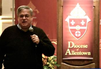 Bishop Alfred Schlert speaks to his brother priests during his talk.