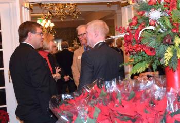 Mary Fran Hartigan, left, chats with guests as they arrive.