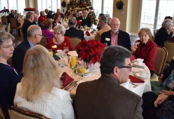Sister Janice Marie Johnson, third from left, enjoys the brunch with guests.