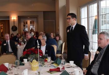 Seminarian Giuseppe Esposito is introduced as Philip Fromuth listens at right.