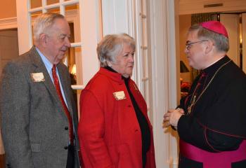 The Honorable William and Maureen Platt, left meet Bishop Alfred Schlert.