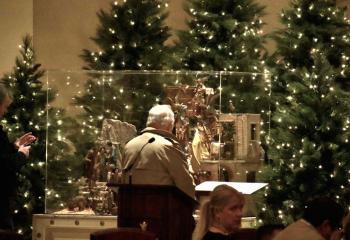 A parishioner looks at the nativity. Bishop Alfred Schlert asked Diocesan Catholics to “consider inviting someone who has been away from the Church home for Christmas Mass. What more beautiful gift can you give your family and friends this Christmas than the love of Christ through his Church?”