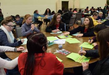 Candidates create cards for prisoners and assemble sacrifice beads. (Photo by John Simitz)