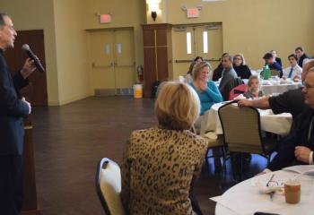 Father Bernard Ezaki, assistant pastor of St. Jane Frances de Chantal, Easton, offers his talk at the banquet.