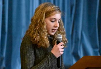 Katie Hawkins reads her award-winning essay. (Photo by John Simitz)