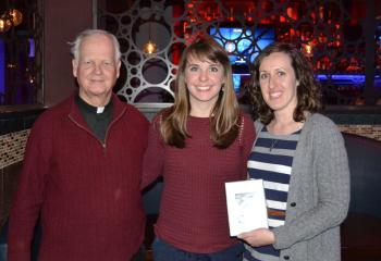 Msgr. Mannion presents a relic of Mother Theresa to the Office of Youth, Young Adult at Family Ministry. Accepting are Thea Aclo, right, direcor, and Alexa Doncsecz, assistant director.