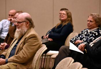 The audience listens as Father Kraft details the faith life of Elisabeth Leseur and her atheist husband, Felix.