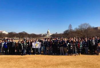 The group from ACCHS displays its support for life. (Photo courtesy of Father Mark Searles)