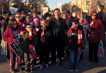 Father Frank Pavone greets the group from Schuylkill County. (Photo courtesy of Heather Smalley)