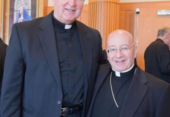 Bishop William Waltersheid, right, chats with Msgr. Robert Wargo, pastor of St. Joseph the Worker, Orefield.